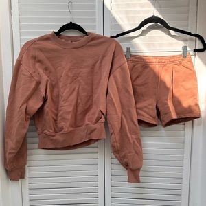 Skims outdoor fleece set in tigers eye color. Top is S, Bottoms XXS. Brand new!